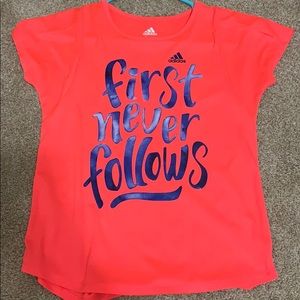 pink/orange and blue adidas shirt.